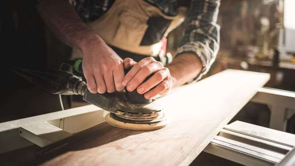 Using sandpaper on wooden strip